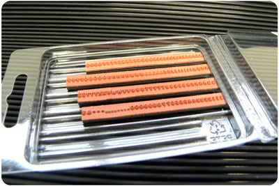 RIBtype TA7 letter and figure set with four orange character strips visible